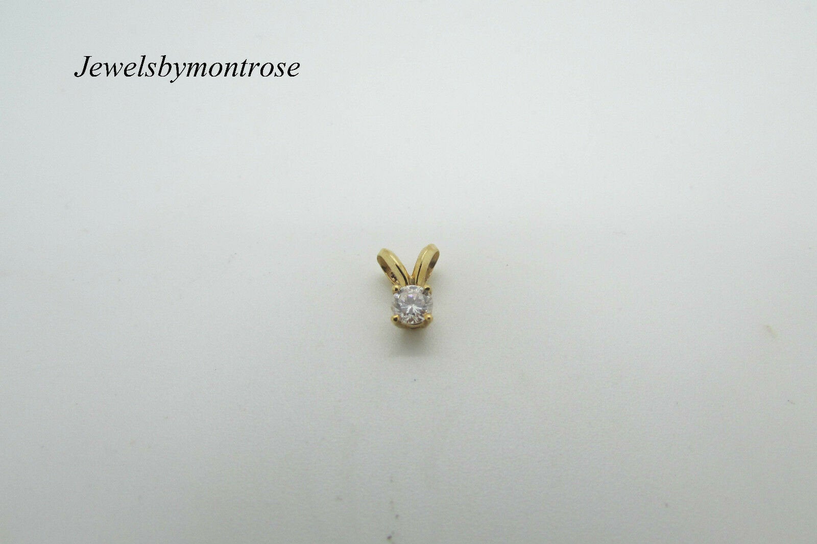 14K Yellow Gold Rabbit Ear Round Diamond Pendant 1.5 Grams 0.15 Cts