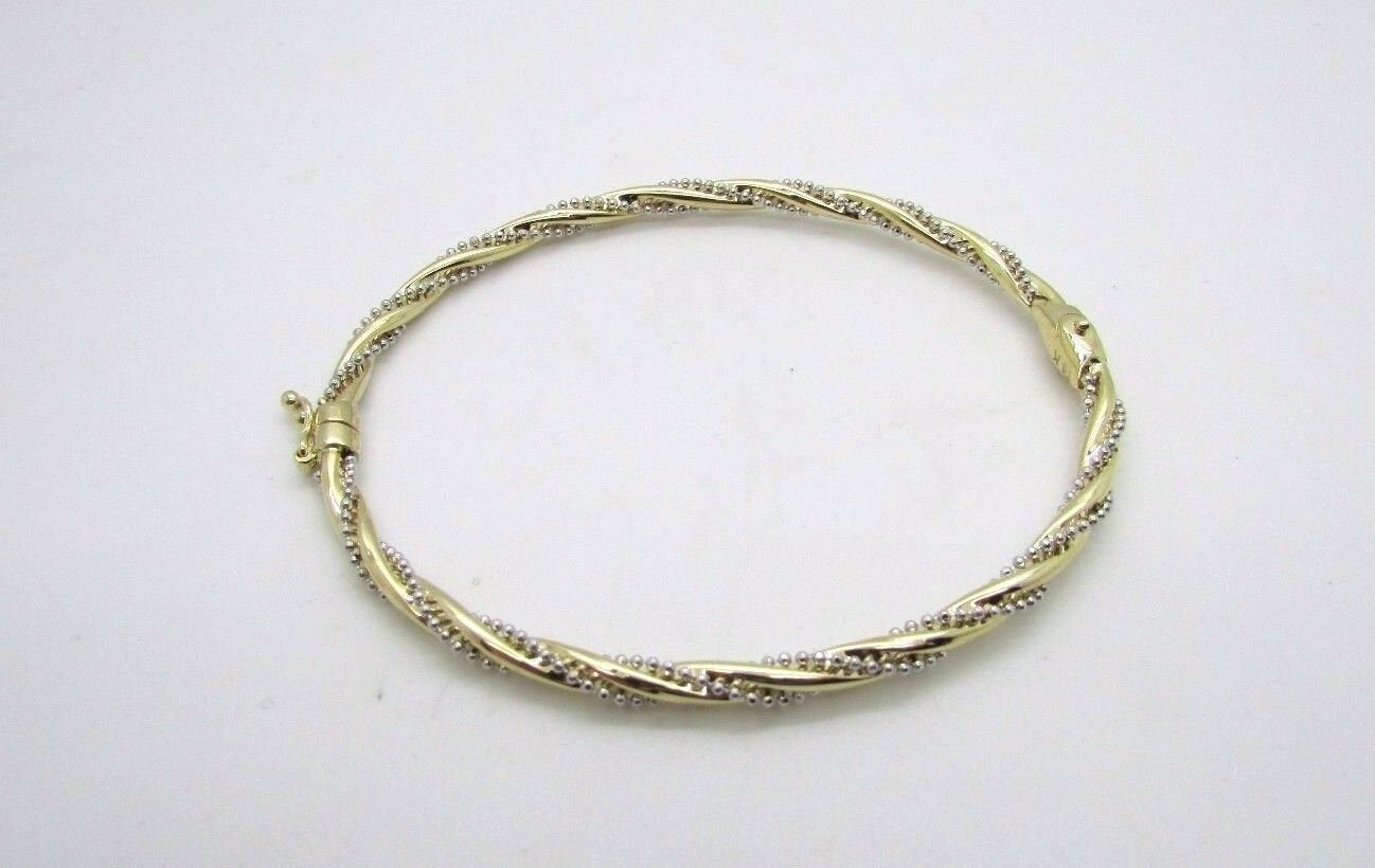 14K Pretty Two Tone Gold Bracelet With Twisted Diamond Cut Chain Wrapped Around