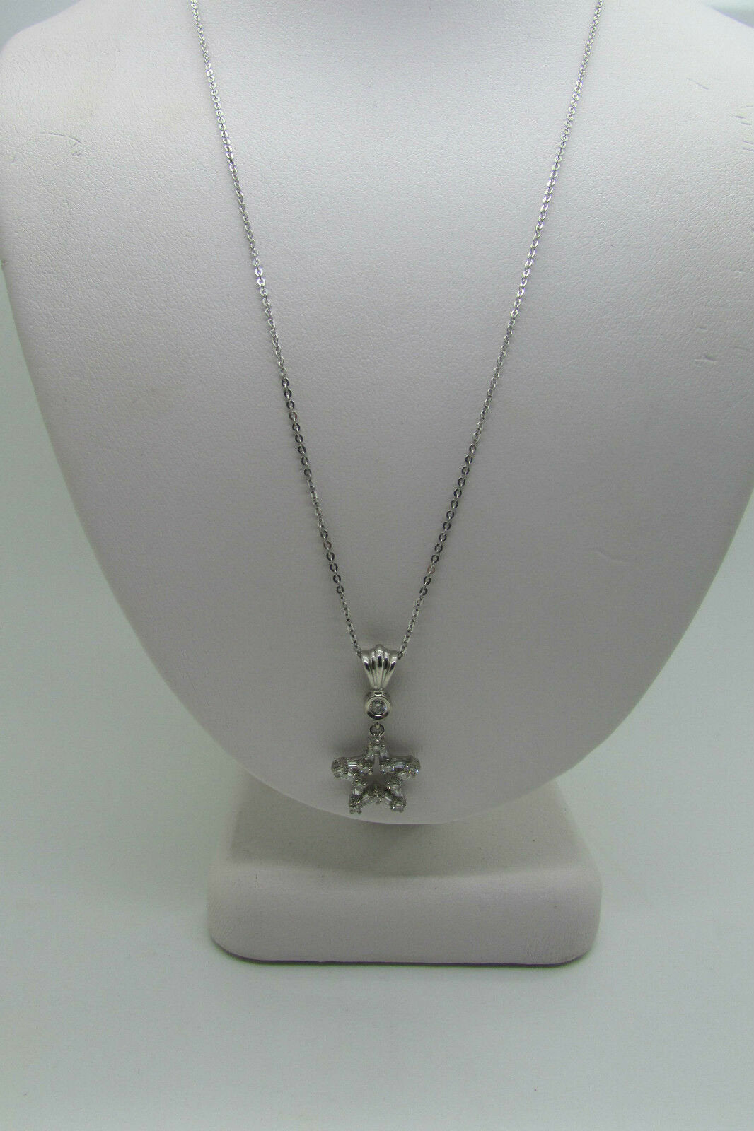 18K Pretty White Gold Star Pendant With Round Diamonds And Baguettes 0.51 Cts