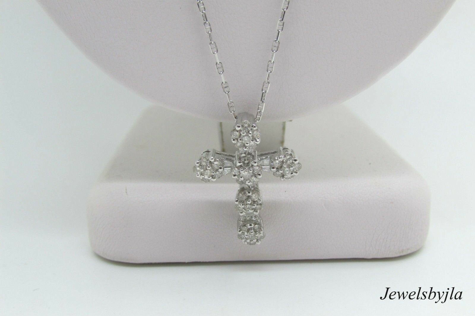 14K White Gold Clustered Cross Pendant With Round Diamonds and Baguettes 0.99 Cts