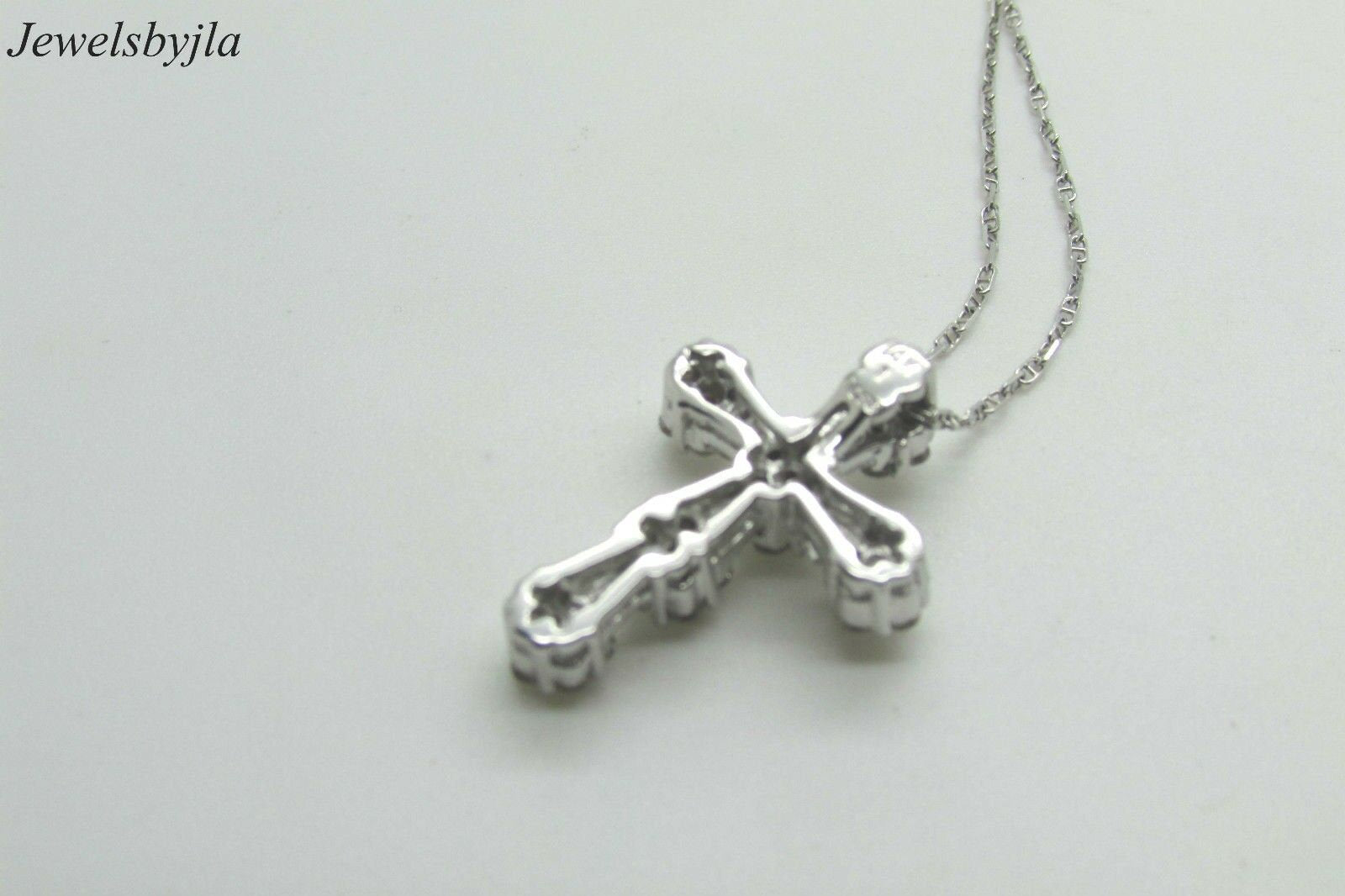 14K White Gold Clustered Cross Pendant With Round Diamonds and Baguettes 0.99 Cts