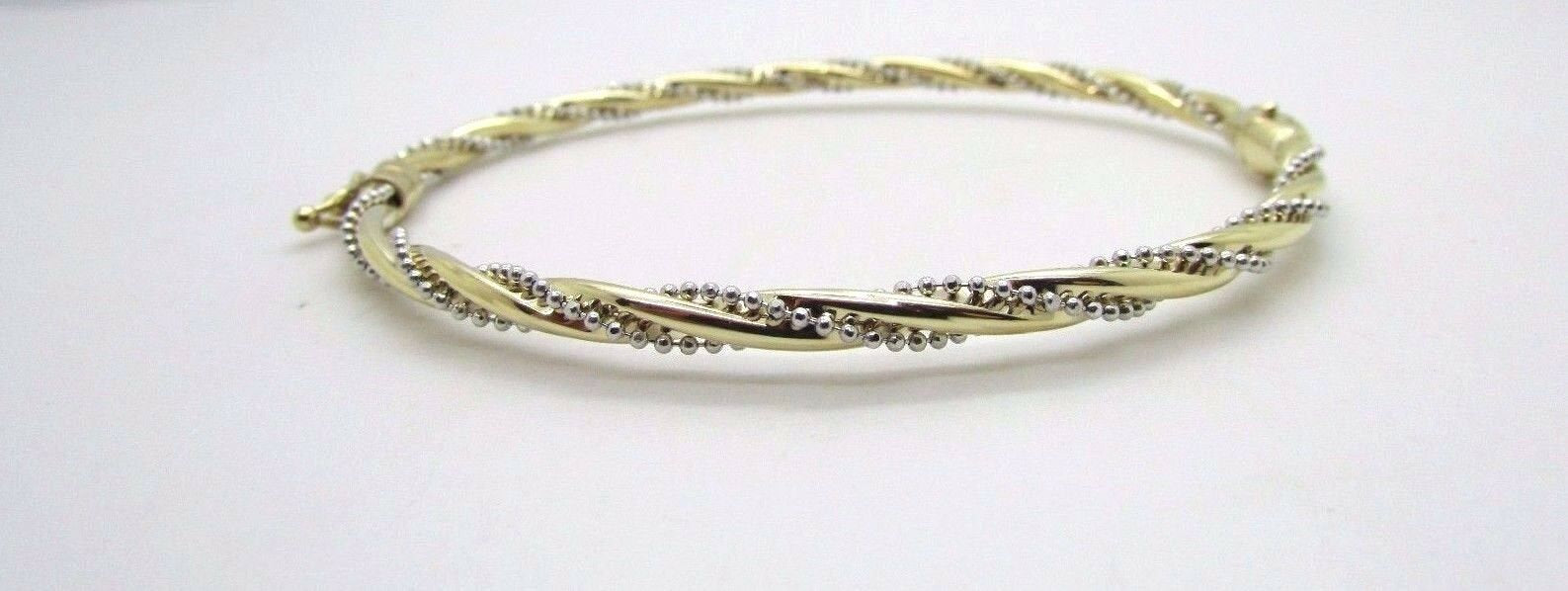 14K Pretty Two Tone Gold Bracelet With Twisted Diamond Cut Chain Wrapped Around