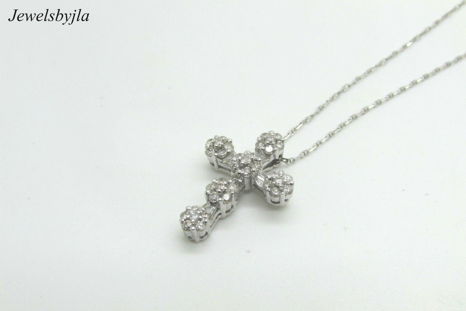 14K White Gold Clustered Cross Pendant With Round Diamonds and Baguettes 0.99 Cts