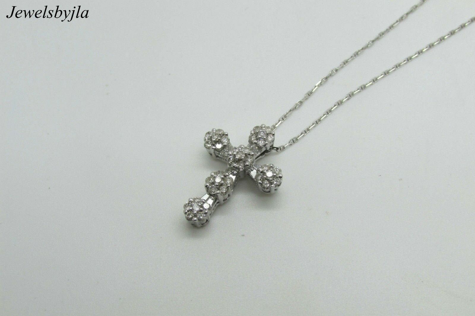 14K White Gold Clustered Cross Pendant With Round Diamonds and Baguettes 0.99 Cts