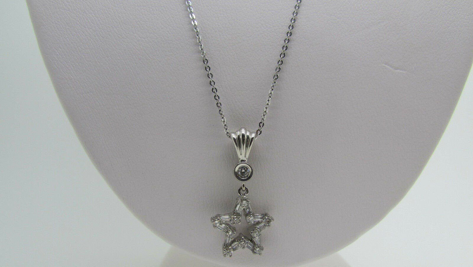 18K Pretty White Gold Star Pendant With Round Diamonds And Baguettes 0.51 Cts